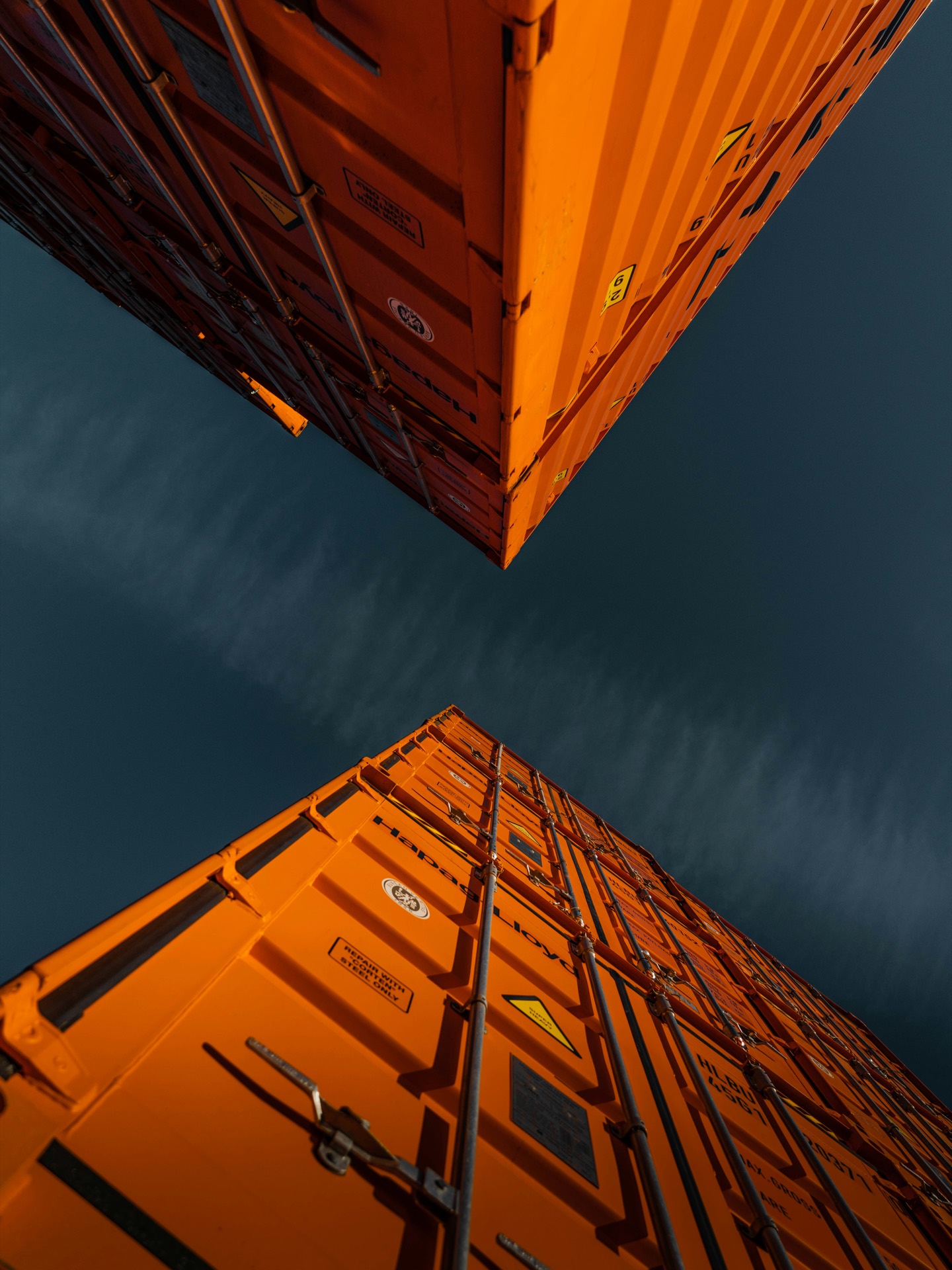 Orange containers stacked skyward